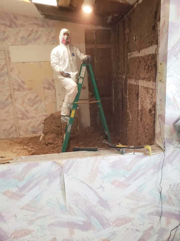 restoration team performing structural repair work on property