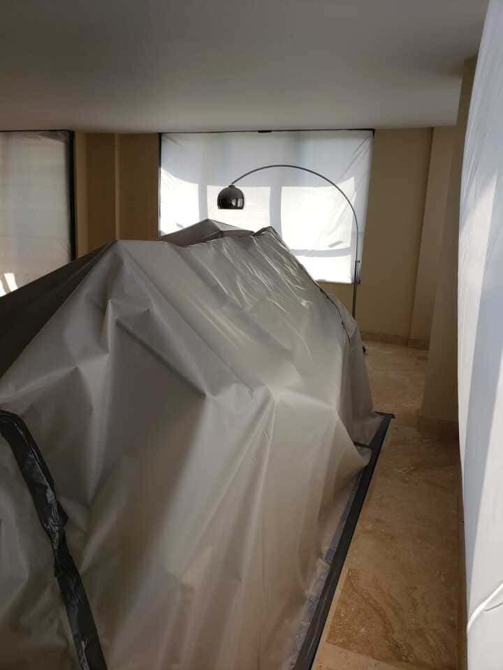 furniture covered and protected during home restoration