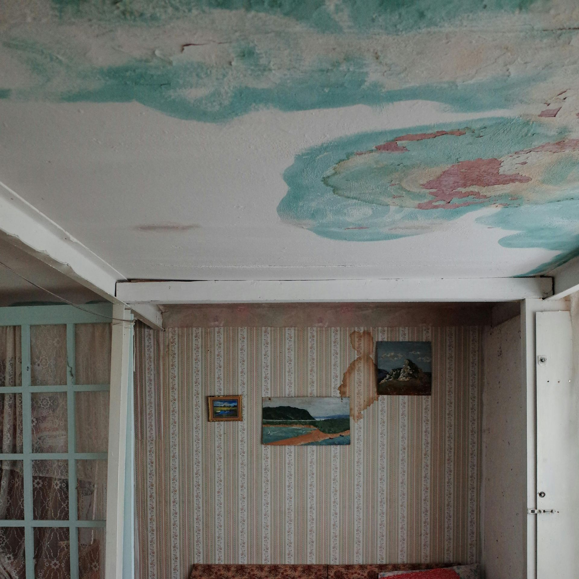 Ceiling showing signs of significant water damage.