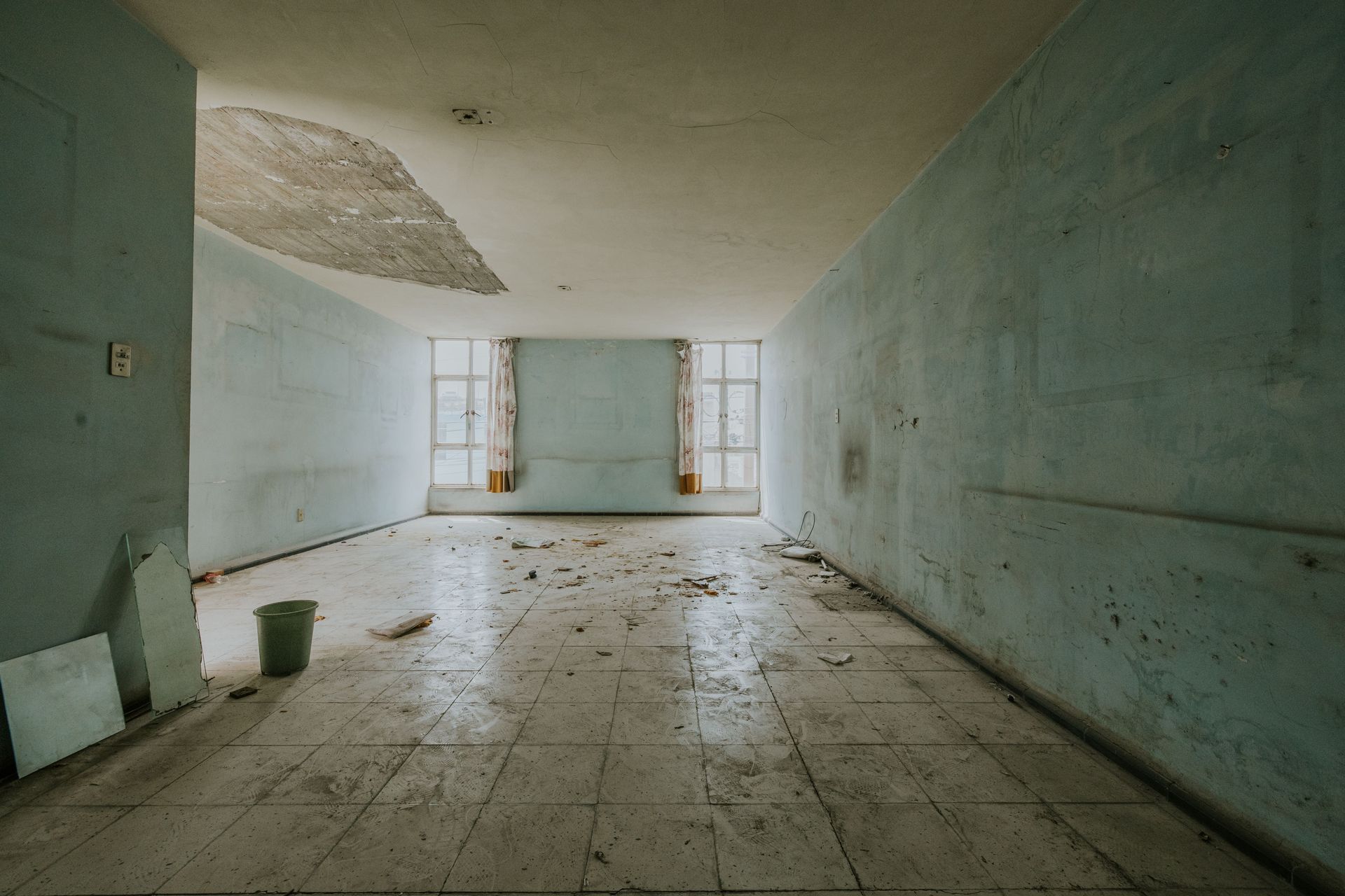 Water damage visible on residential floors in Fort Myers.