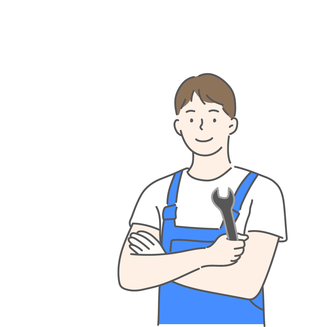 Mechanic with folded arms holding a wrench, wearing blue overalls, smiling.