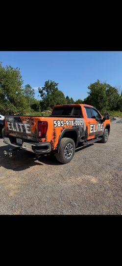 An orange pickup truck with 