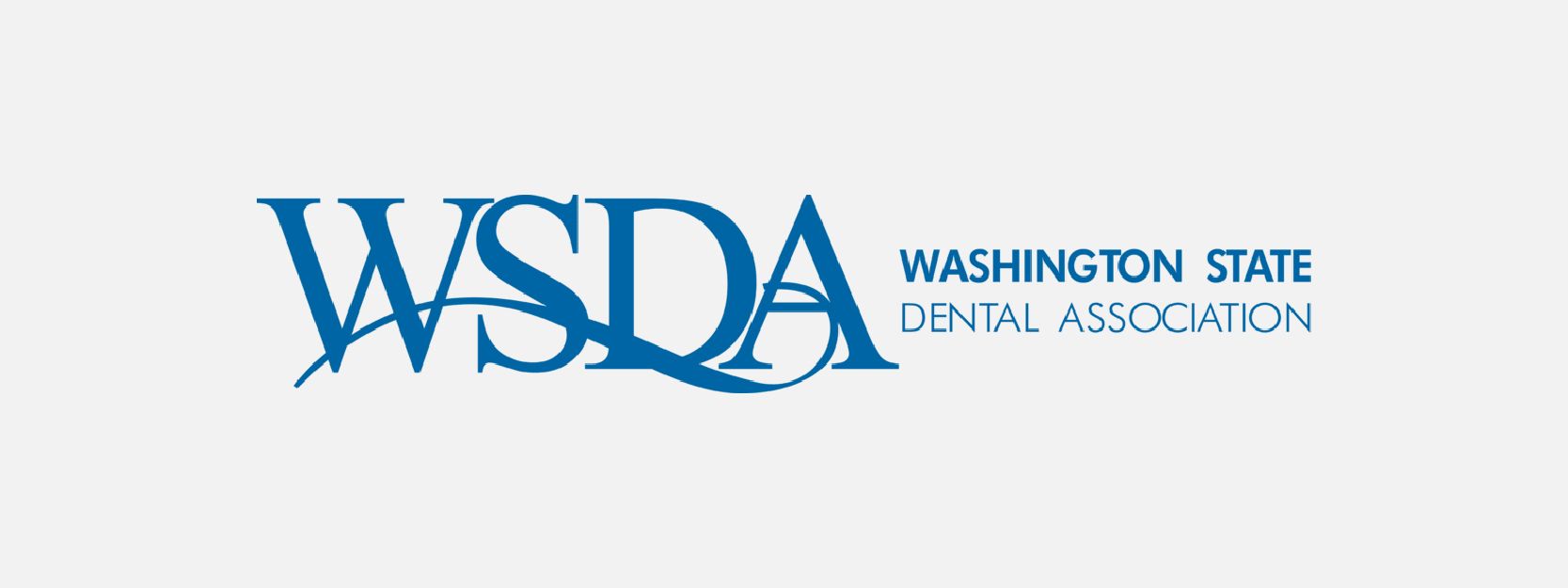 The logo for the washington state dental association is blue and white.