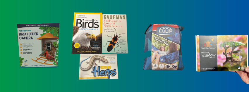 Books and magazines arranged on a blue surface, including titles about birds and gardening.