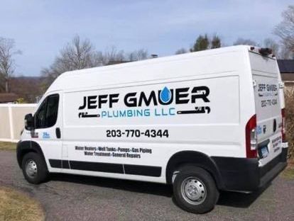 A jeff gmuer plumbing llc van is parked on the side of the road