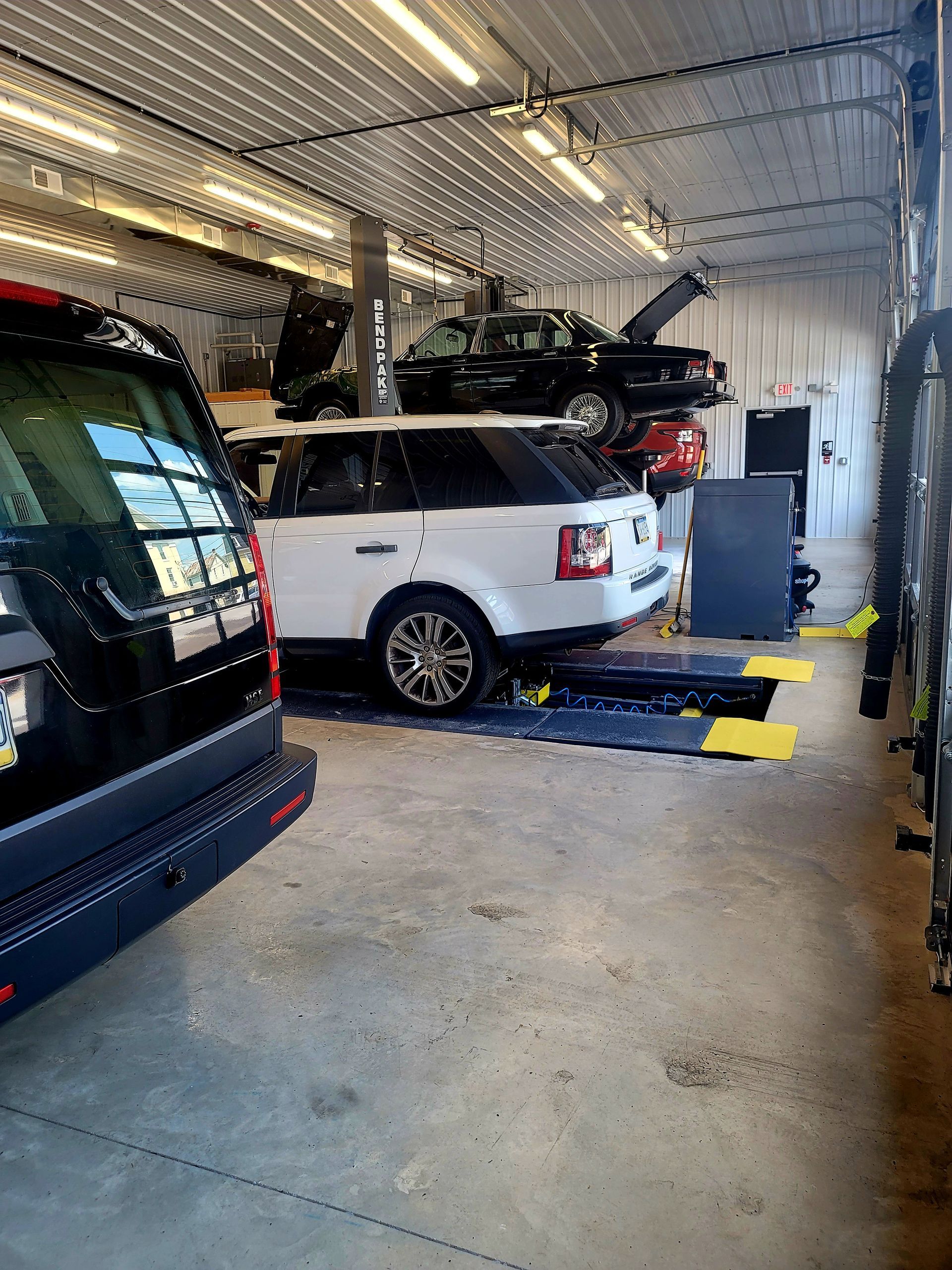 Vehicles inside of our garage bay in Hummelstown, PA | Crowne Automotive