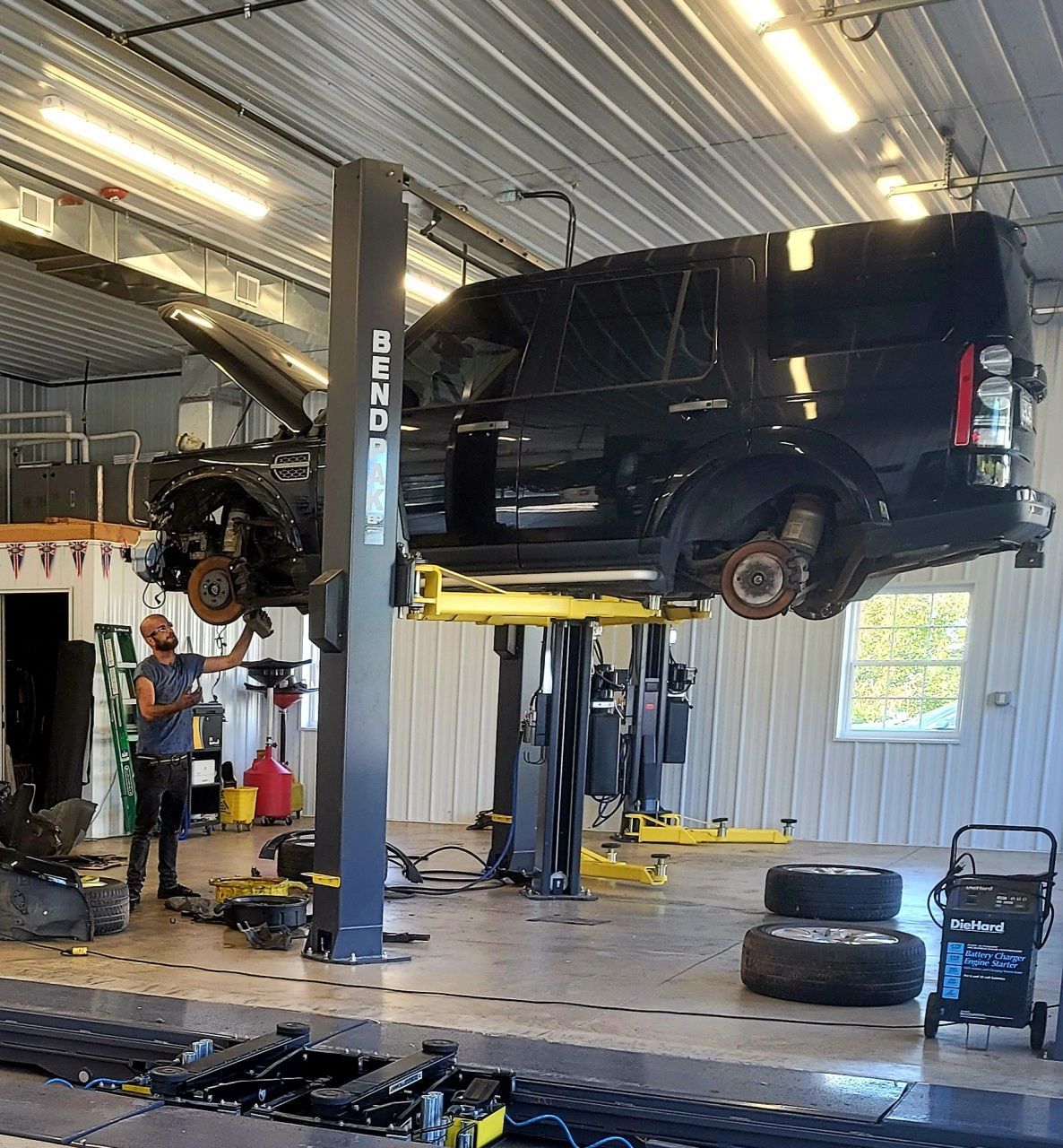 Repairing a vehicle inside of our garage bay in Hummelstown, PA | Crowne Automotive