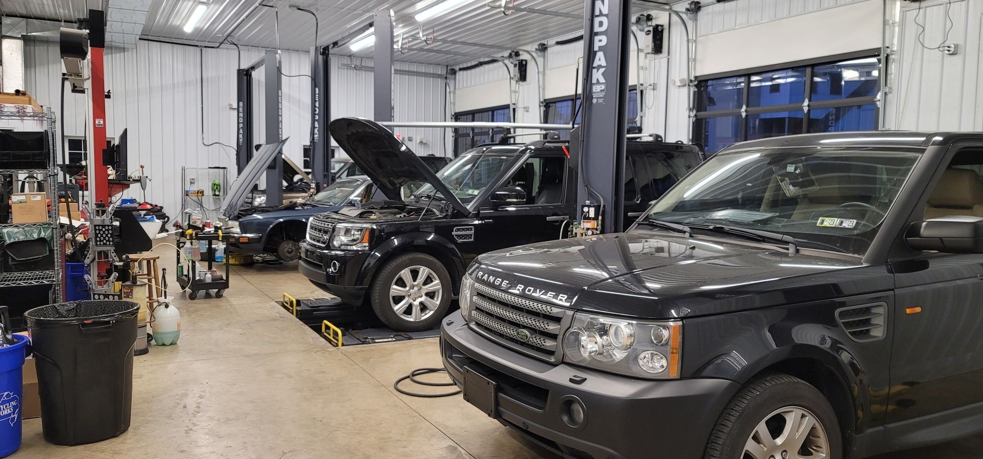 Vehicles inside of our garage bay in Hummelstown, PA | Crowne Automotive