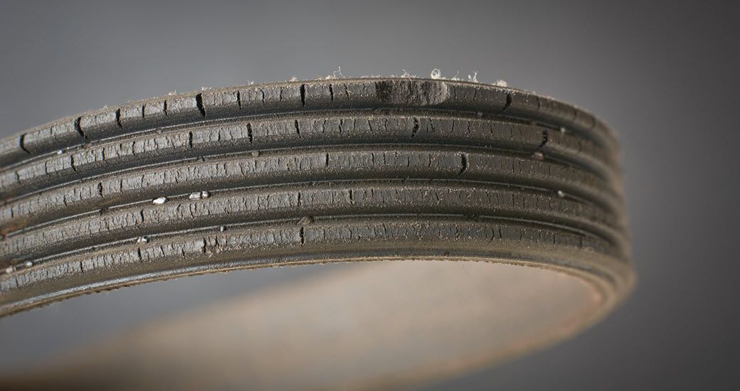 Up close to serpentine belt with some wear and tear | Crowne Automotive