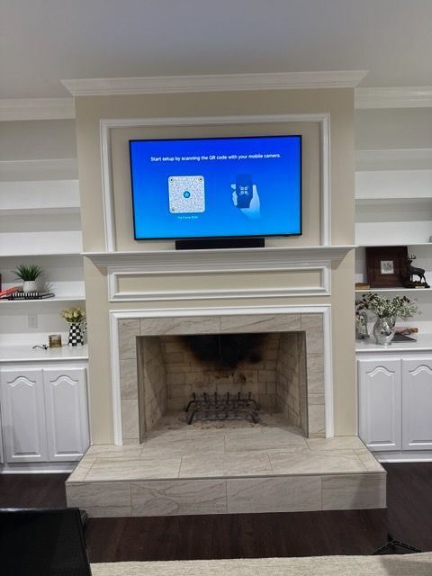 A living room with a large white screen on the wall.