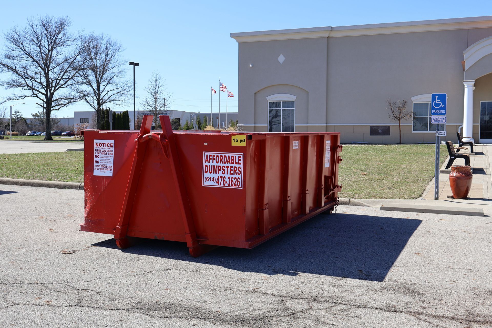Red 20-yard dumpster labeled 