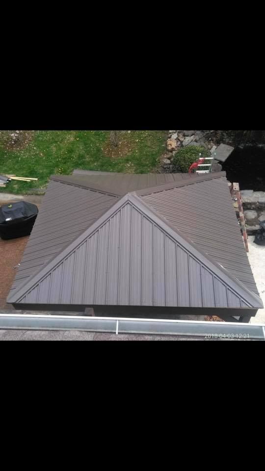 An aerial view of a roof with a triangle shaped roof.