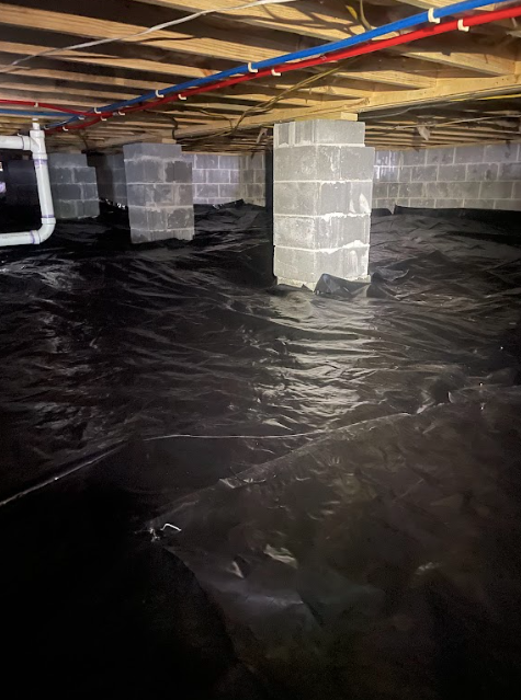 A flooded basement with a lot of water coming out of it.