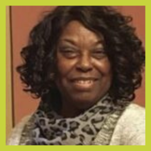 A photo of an African American woman wearing a leopard scarf