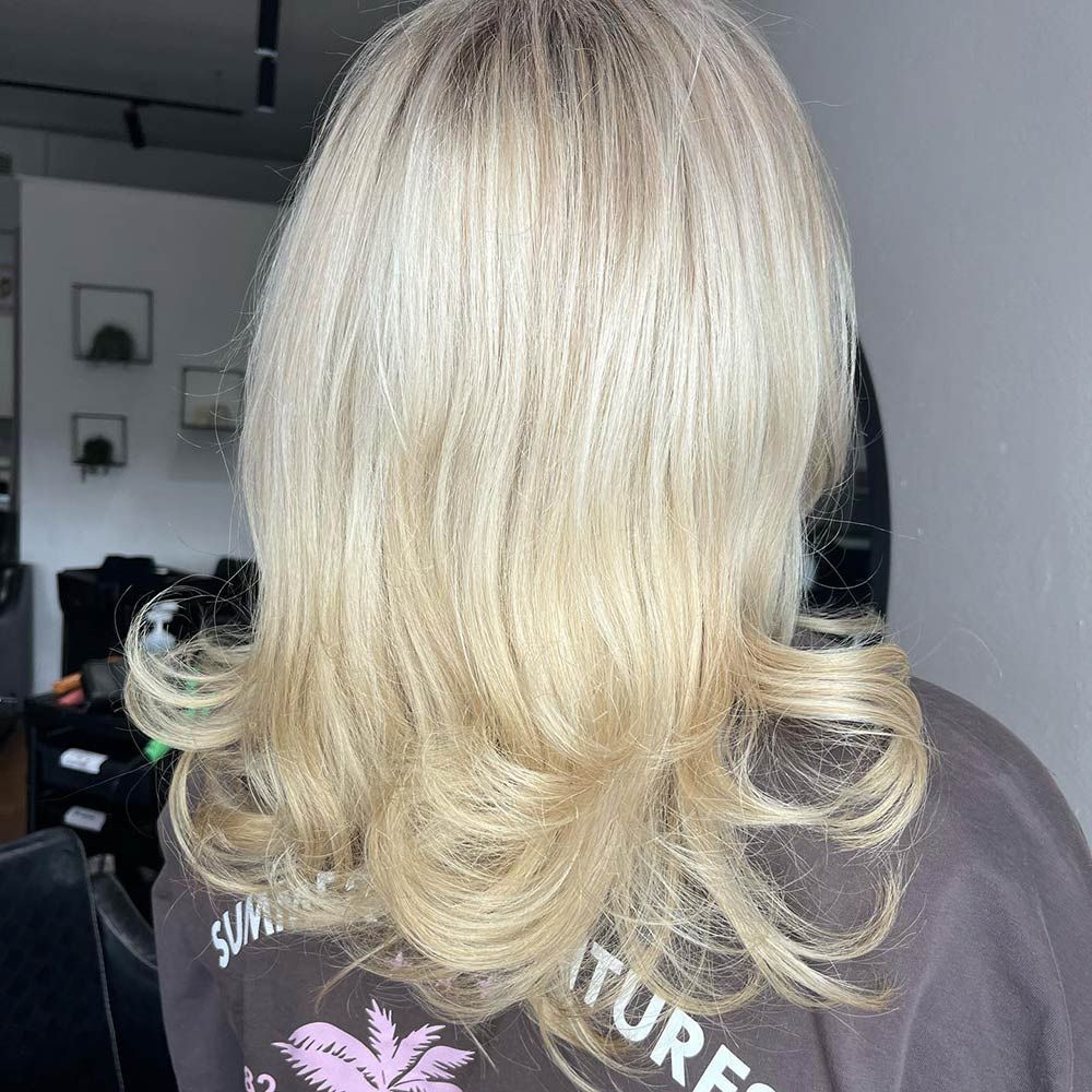 A Woman With Blonde Hair is Wearing — Hairenvy in Ettalong Beach, NSW