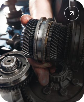Hand holding a metal gear | Kelly Automotive