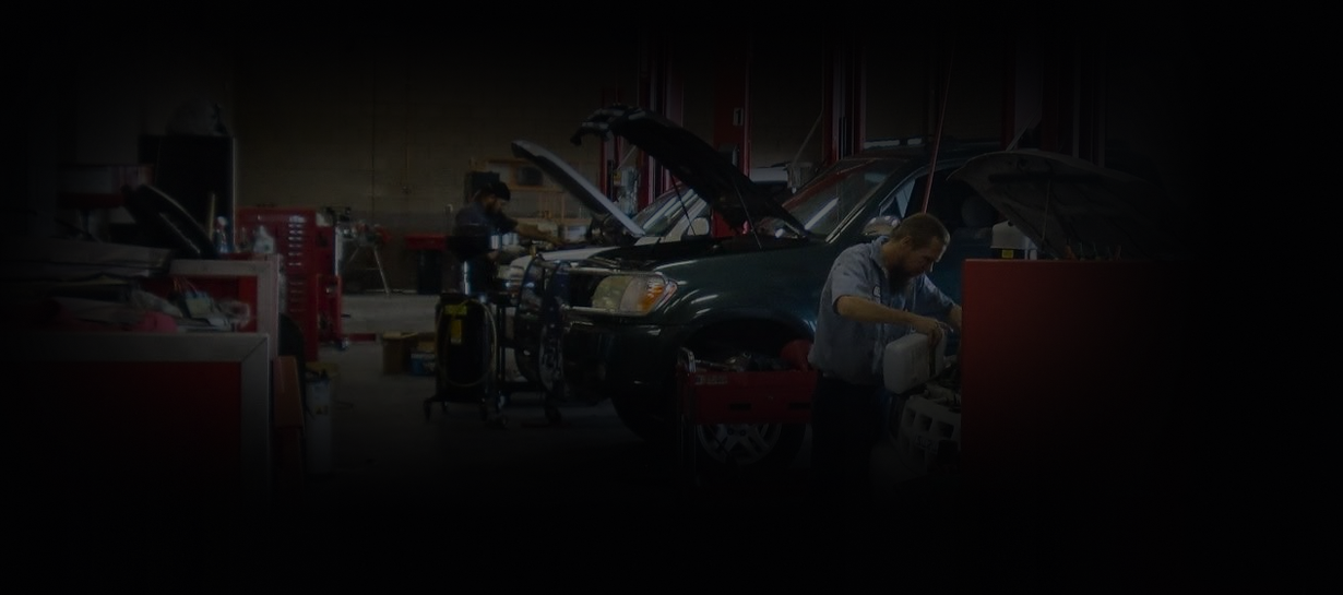 Dimly lit auto repair shop | Kelly Automotive