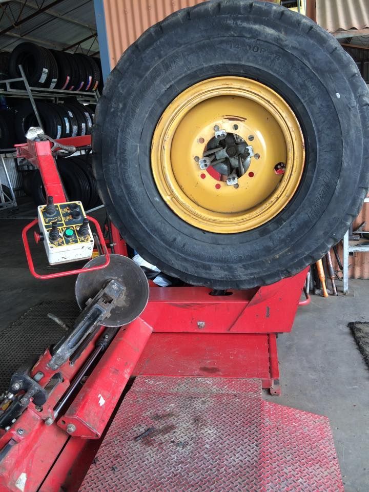 A Wheel With Machinery In A Tyre Workshop — Bernie's Tyres In Kawana, QLD