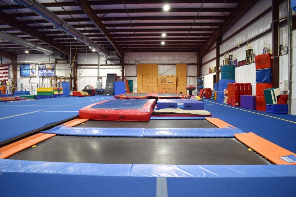 There are a lot of trampolines in this gym.