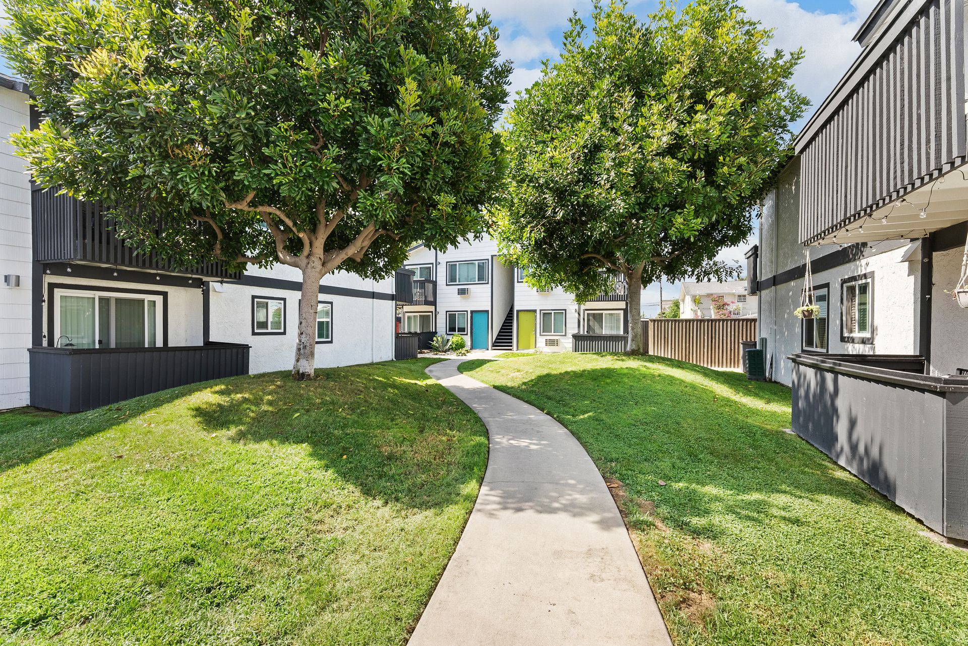 Sliding Photo Gallery Displaying Community Amenities - Grass with walking path
