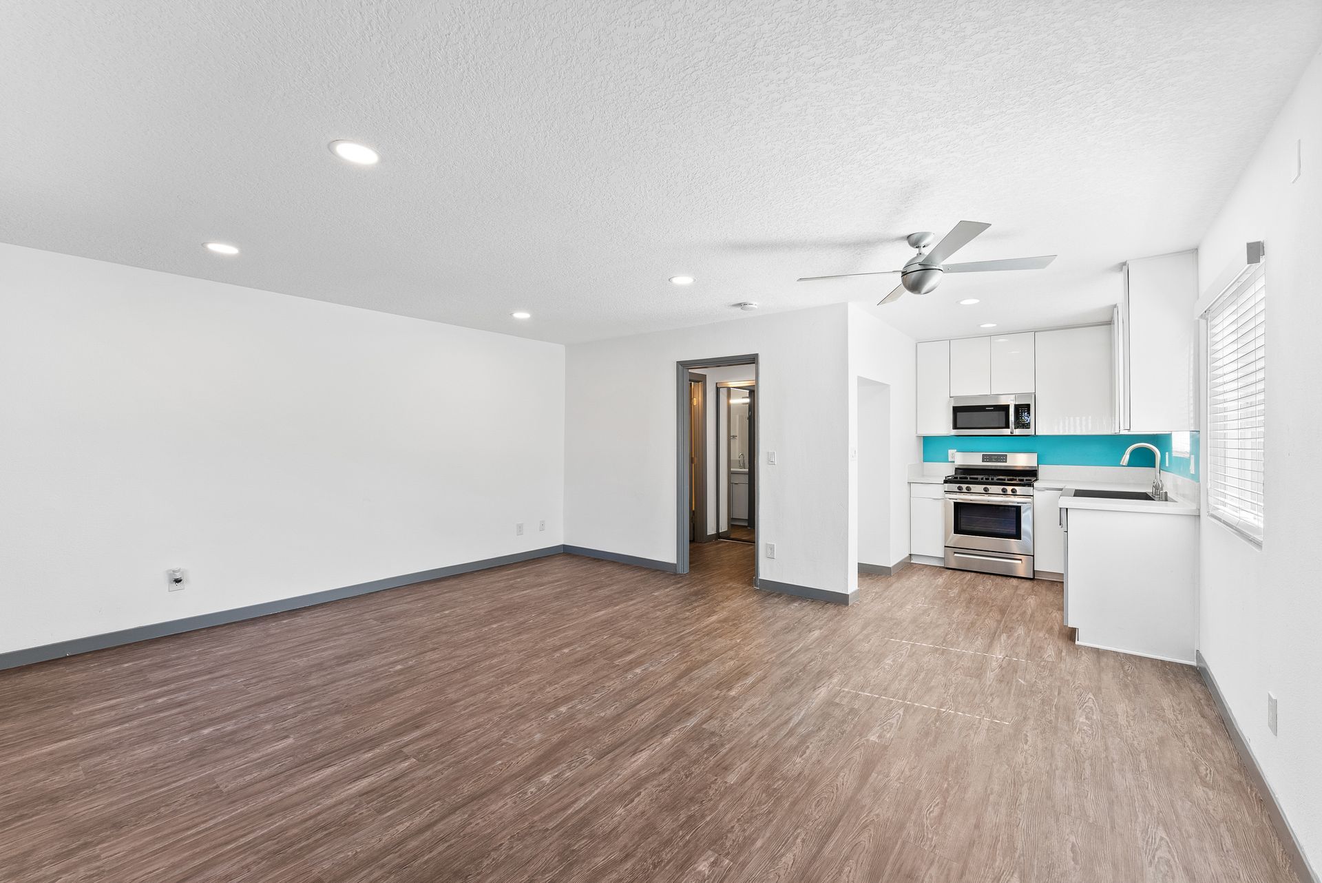 Sliding Photo Gallery Displaying Apartment Features- Kitchen and Living Room