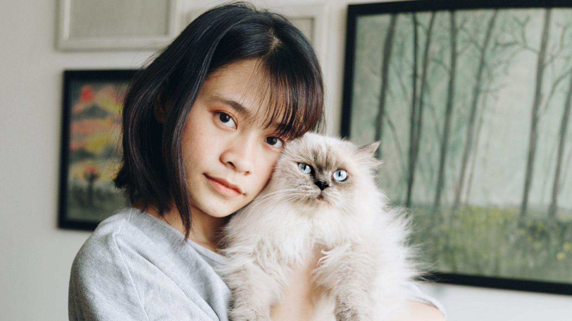 Woman carrying her cat