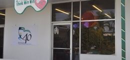 A dental office with a tooth on the front of it.