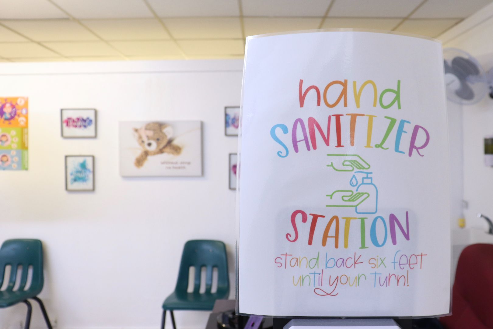 A hand sanitizer station in a waiting room