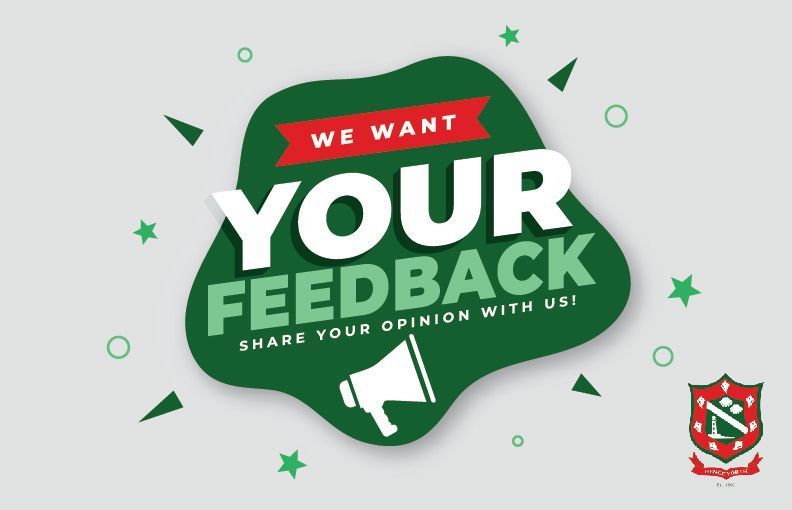 A green sign that says we want your feedback