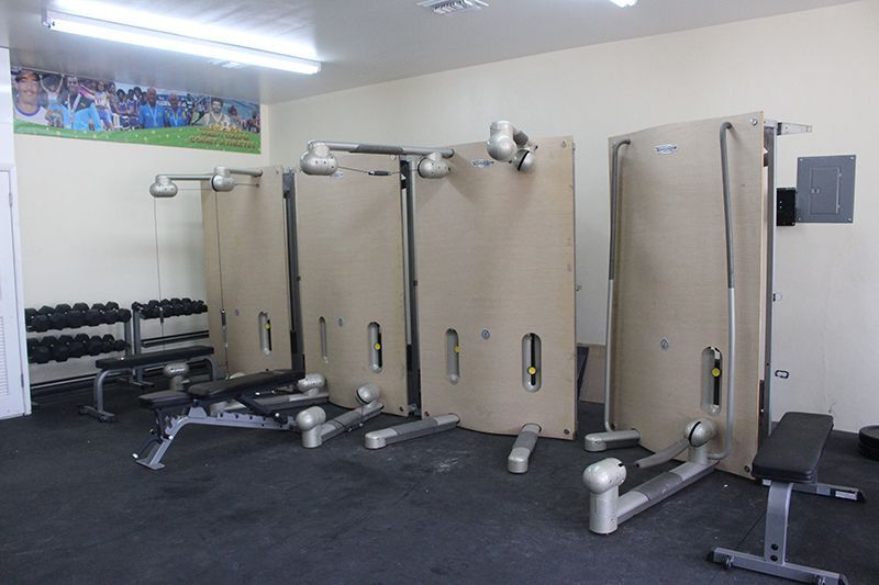 A gym with a picture of a soccer field on the wall