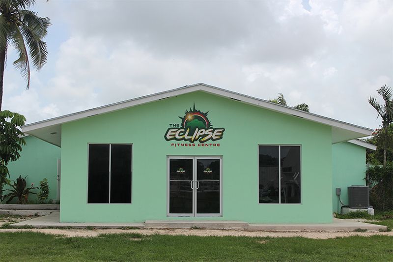A green building with the word eclipse on it