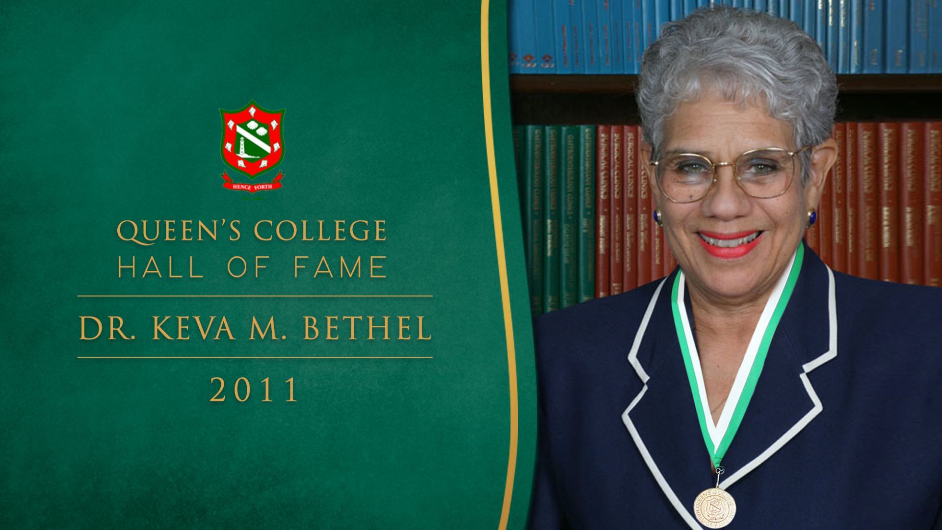 A woman wearing glasses and a medal from queen 's college