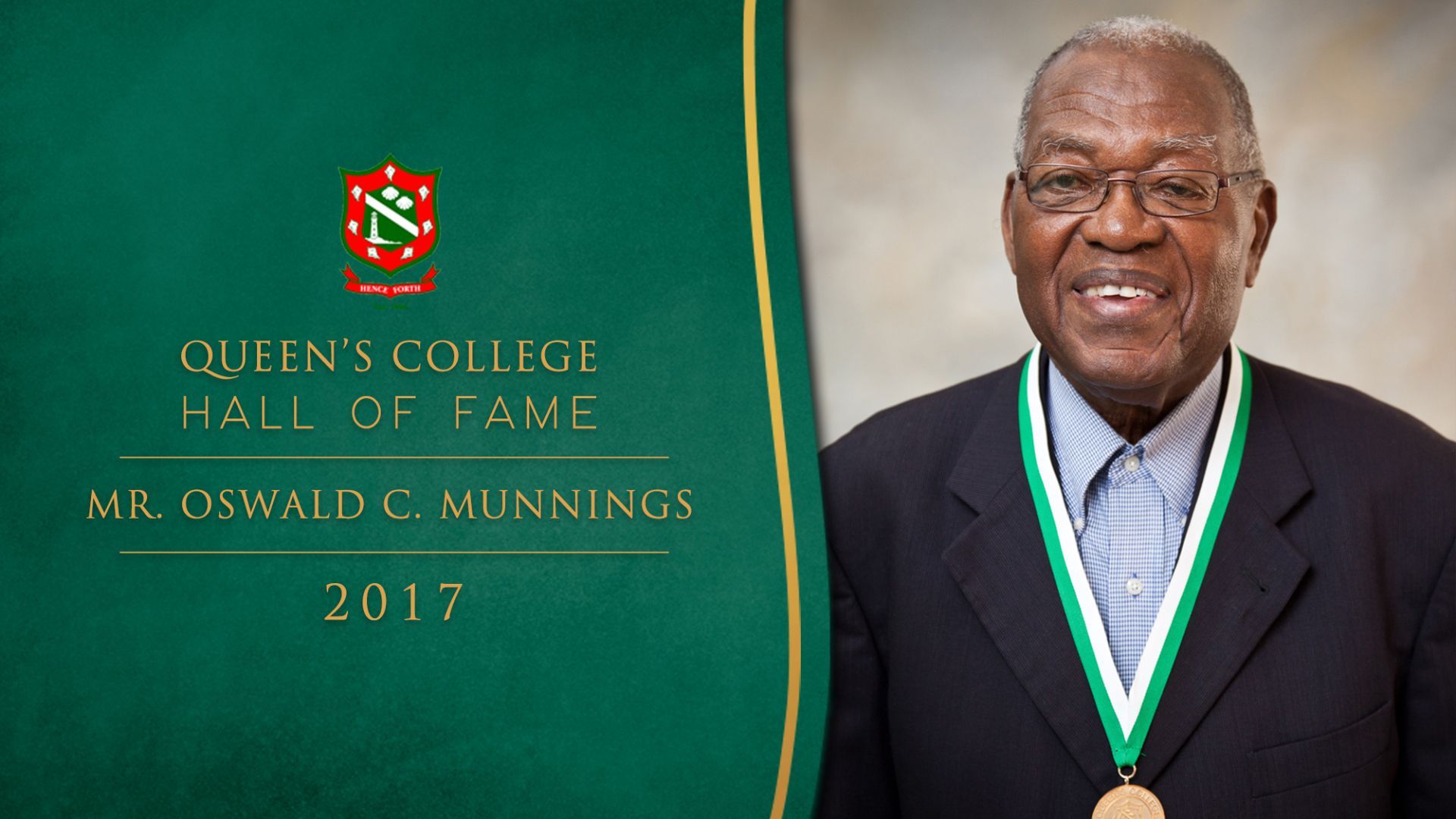 A man wearing a medal with the year 2017 on it
