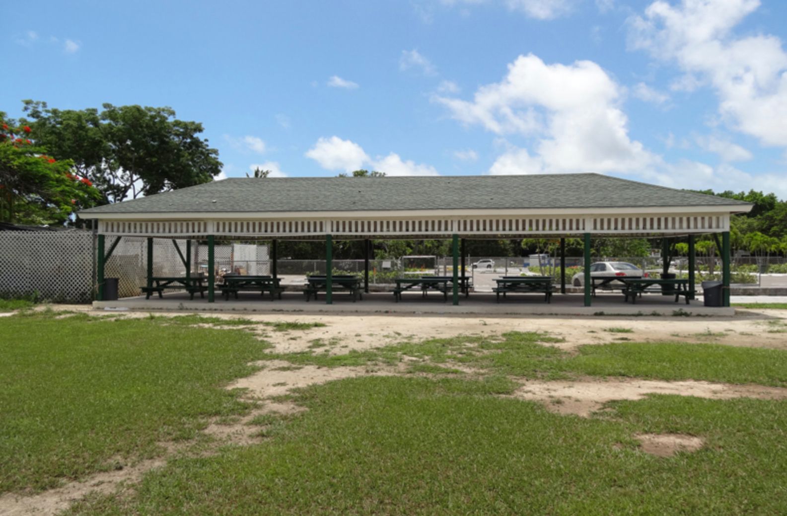 A picnic shelter with tables and benches underneath it