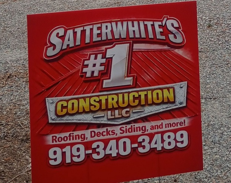 Red Satterwhite's #1 Construction Services yard sign with phone number 919-340-3489.