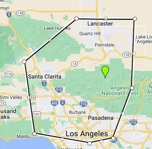 Map of Los Angeles area with a black outlined route and a green location pin in the national forest.