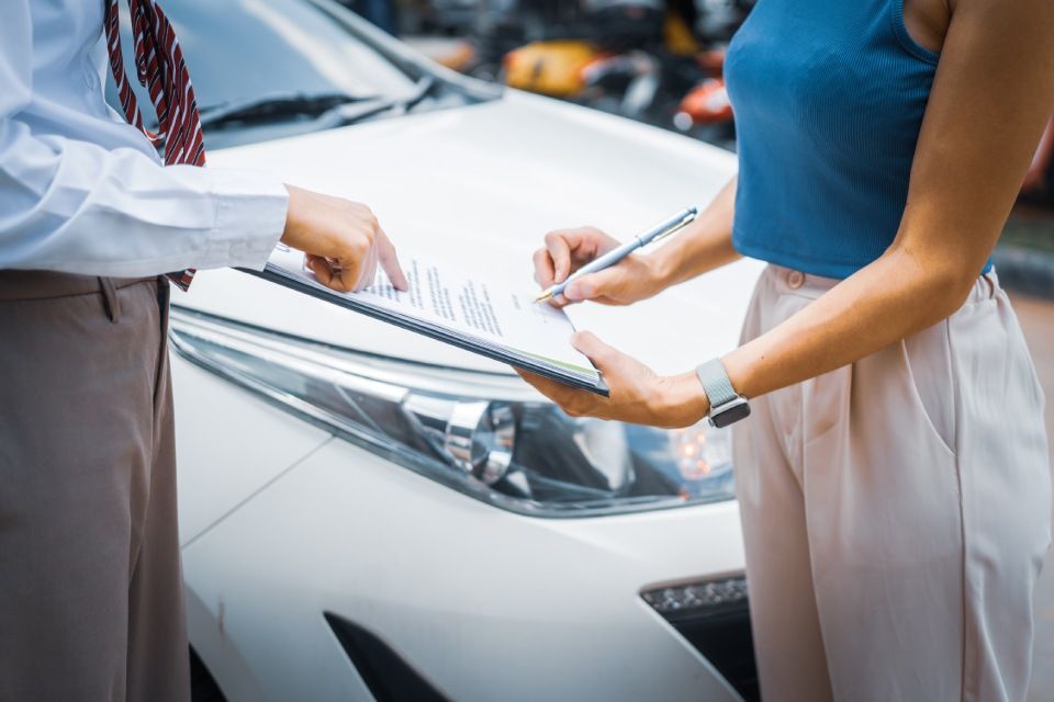 A young businesswoman is navigating car insurance