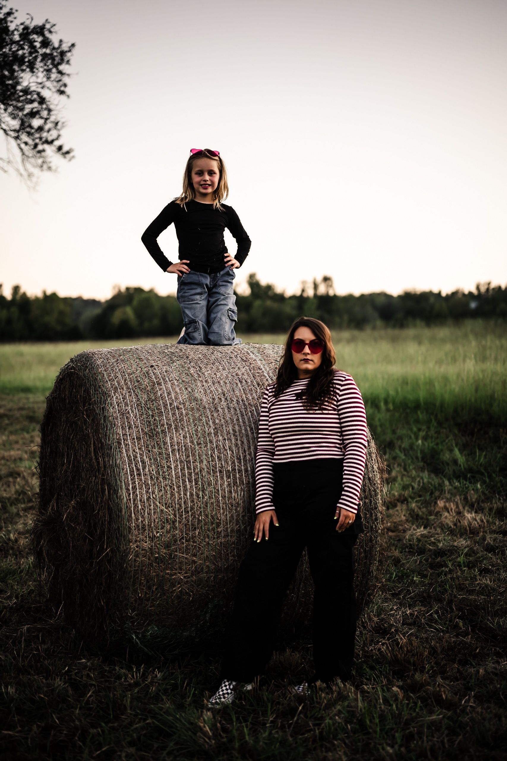 family photo on hay bales