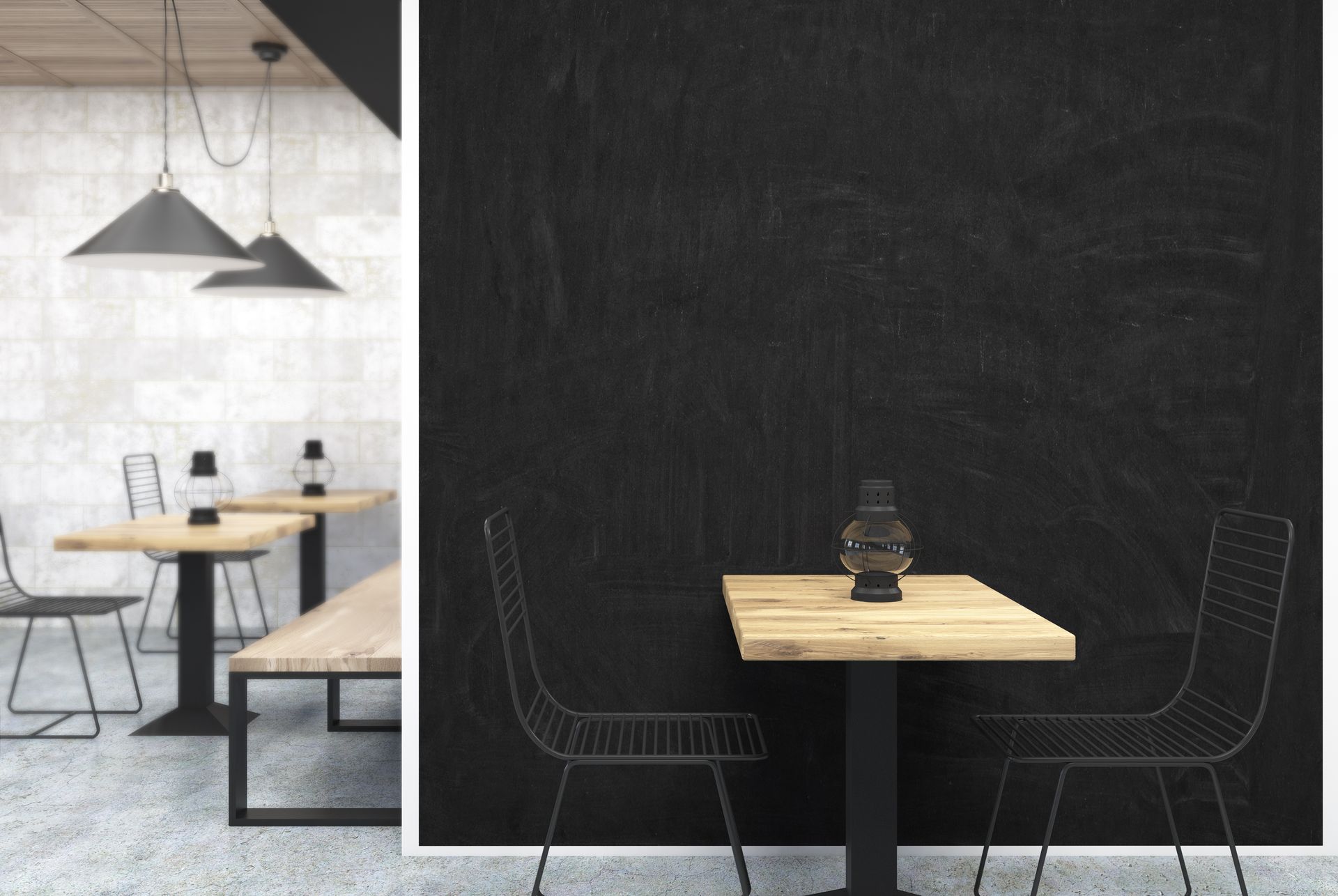 A restaurant with tables and chairs and a black wall