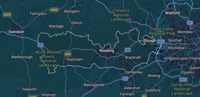 Dark map showing towns and roads in southeast England, centered on Reading and London.