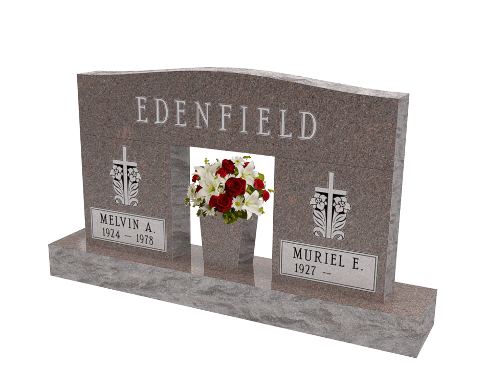 An example of a double upright monument in a brown granite shown with a center flower vase holding white and red flowers.