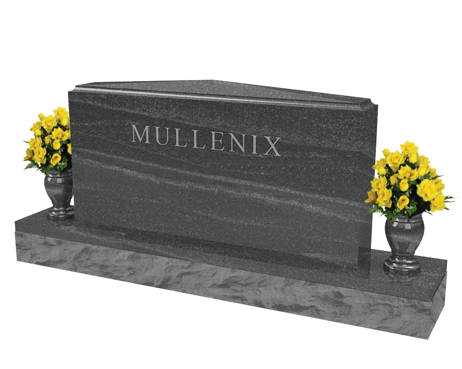 An example of a double upright monument in a mixed grey granite shown with yellow flowers in vases on both sides.