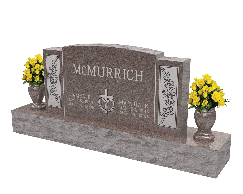 An example of a double upright monument in a brown granite shown with yellow flowers in vases on both sides.