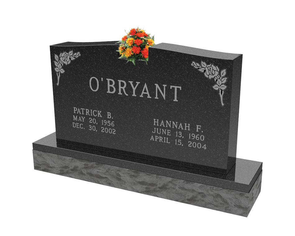 An example of a double upright monument in dark light grey granite shown with orange flowers on top.
