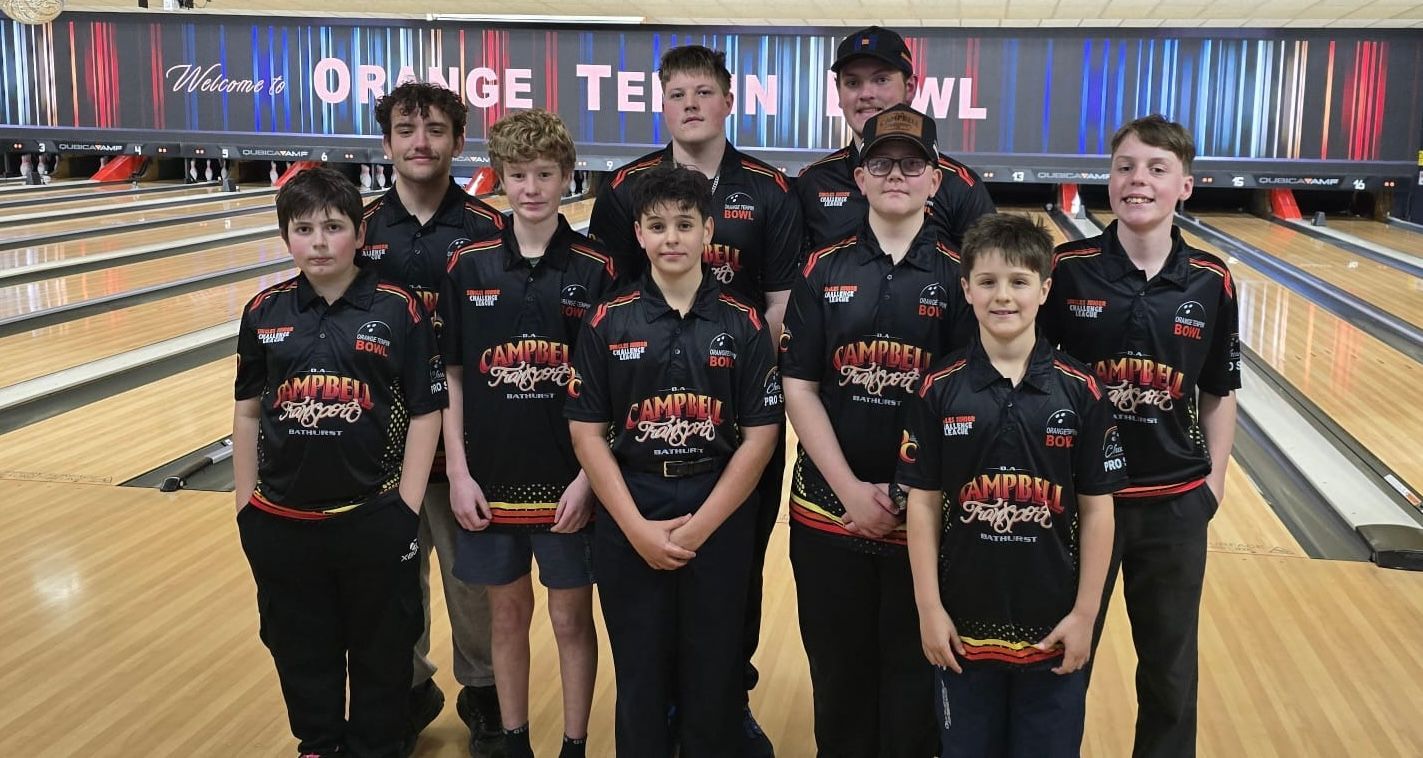 Youth Bowling Team Posing in Matching Black Uniforms at a Bowling Alley — Orange Tenpin Bowl in Orange, NSW