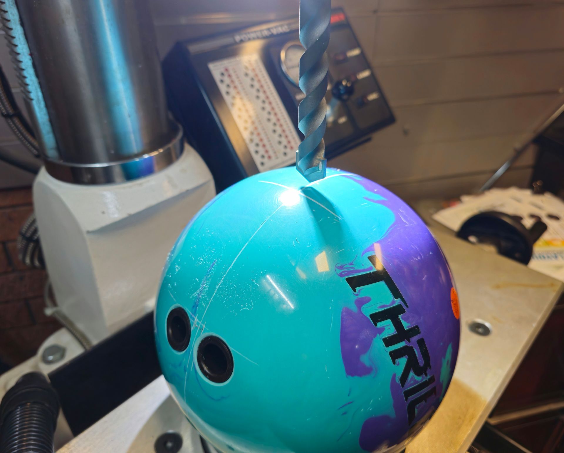 Turquoise Bowling Ball With Black Finger Holes and Purple Paint — Orange Tenpin Bowl in Orange, NSW