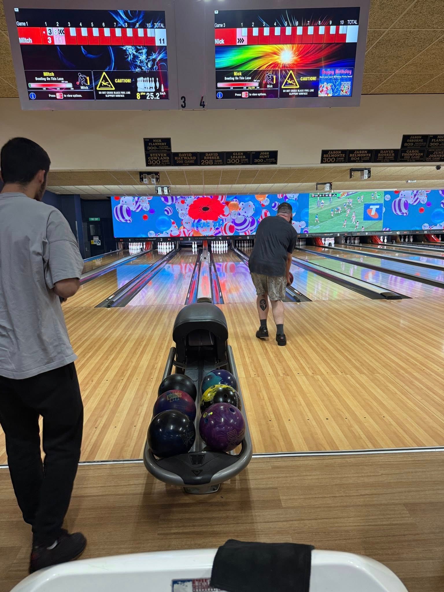 Bowling Alley With Two People at the Lanes, Scoring Screens, and Bowling Balls — Orange Tenpin Bowl in Orange, NSW