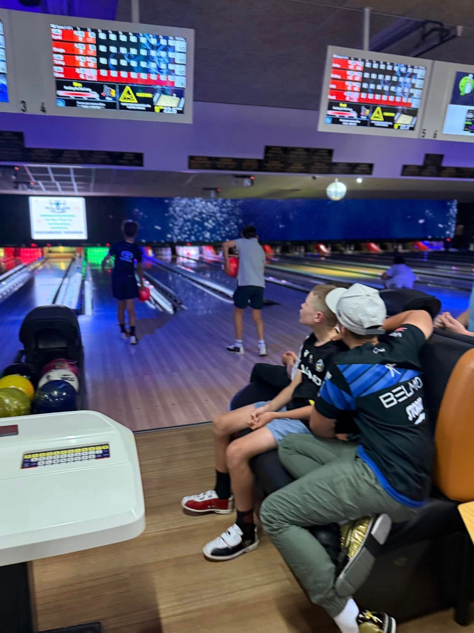 Bowling Alley With People Seated and Bowling, Scoreboards Glowing Above the Lanes — Orange Tenpin Bowl in Orange, NSW