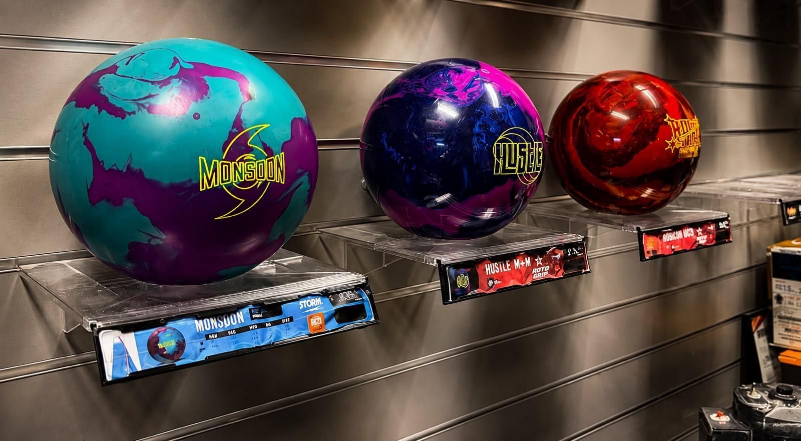 Bowling Balls Displayed on a Wall Rack in a Bowling Alley Pro Shop — Orange Tenpin Bowl in Orange, NSW