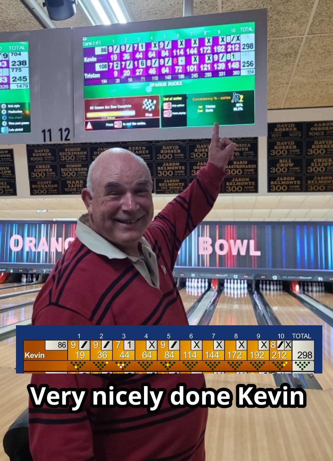 Smiling Man Points at Bowling Scoreboard at Orange Bowl — Orange Tenpin Bowl in Orange, NSW